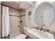 Bathroom with stand up shower and tiled walls at 7331 S Webster St, Littleton, CO 80128