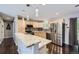 Bright kitchen with stainless steel appliances, granite countertops, and wood cabinets at 7331 S Webster St, Littleton, CO 80128