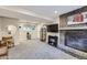 Finished basement features a brick fireplace, media center, and ample space at 7331 S Webster St, Littleton, CO 80128