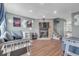 Cozy living room with a stone fireplace and modern decor at 9240 W Ontario Dr, Littleton, CO 80128