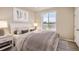 Well-lit bedroom featuring a large window, and neutral tones at 6817 Huddersfield Ln, Castle Pines, CO 80108