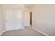 Bright bedroom with closet and white doors at 6817 Huddersfield Ln, Castle Pines, CO 80108