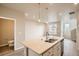 Well-equipped kitchen features an island with sink and modern faucet at 6817 Huddersfield Ln, Castle Pines, CO 80108