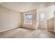 Inviting living area with large window and natural light at 6817 Huddersfield Ln, Castle Pines, CO 80108