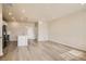Bright living room featuring hardwood floors, recessed lighting, and an open concept layout at 6817 Huddersfield Ln, Castle Pines, CO 80108