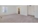 Bright and airy bedroom with neutral carpet and ensuite bathroom, offering comfort and privacy at 4757 Windmill Dr, Brighton, CO 80601