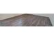 Close-up of wood-look flooring, white walls, and modern trim at 4757 Windmill Dr, Brighton, CO 80601