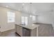 Open-concept kitchen featuring granite countertops, stainless steel appliances, and a view into living room at 4757 Windmill Dr, Brighton, CO 80601