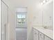 Bathroom view from shower, features vanity and view of the neighborhood at 6882 Huddersfield Ln, Castle Pines, CO 80108