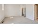 Spacious bedroom with neutral walls and soft carpeting, ready for your personal touch at 6882 Huddersfield Ln, Castle Pines, CO 80108