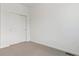 Bedroom featuring neutral carpet and a closet at 6882 Huddersfield Ln, Castle Pines, CO 80108