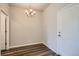 Bright dining room with wood floors and a stylish chandelier, perfect for gatherings at 6882 Huddersfield Ln, Castle Pines, CO 80108