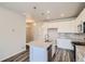 Bright, modern kitchen features white cabinetry, granite countertops, and a central island at 6882 Huddersfield Ln, Castle Pines, CO 80108