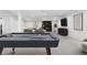 Finished basement with a pool table, TV, and comfortable seating area, great for entertainment at 2255 S Monroe St, Denver, CO 80210