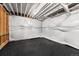 Unfinished basement with vapor barrier on the walls and rubber floor at 2255 S Monroe St, Denver, CO 80210