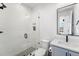 Updated bathroom featuring a glass-enclosed shower with modern fixtures at 2255 S Monroe St, Denver, CO 80210
