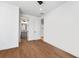 Bright bedroom with wood floors and ensuite bath at 2255 S Monroe St, Denver, CO 80210