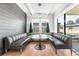 Stylish dining nook with a unique built-in booth, modern lighting, and access to the outdoors at 2255 S Monroe St, Denver, CO 80210