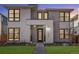 Beautiful home featuring a modern design with a stone and wood facade and professionally manicured landscaping at 2255 S Monroe St, Denver, CO 80210