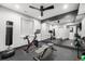 Spacious home gym with ample workout equipment and full wall mirror at 2255 S Monroe St, Denver, CO 80210