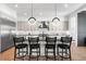 Contemporary kitchen showcasing sleek countertops, a stylish island with seating, and modern pendant lighting at 2255 S Monroe St, Denver, CO 80210