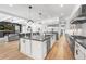 Modern kitchen with a large island, stainless steel appliances, and an open layout to the living area at 2255 S Monroe St, Denver, CO 80210