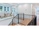 Landing featuring hardwood floors and a glass-enclosed office space with natural light and privacy at 2255 S Monroe St, Denver, CO 80210