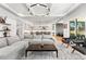 Open-concept living area with stylish furniture, modern lighting, and seamless flow to the kitchen at 2255 S Monroe St, Denver, CO 80210