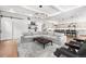 Spacious living area featuring comfortable seating, modern decor, and an open layout connecting to the kitchen at 2255 S Monroe St, Denver, CO 80210
