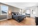 Comfortable bedroom features wood floors, stylish furniture, and decorative accents at 2255 S Monroe St, Denver, CO 80210