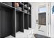 Mudroom features cubbies with shelving and drawers, and a glass door with a view to the outdoors at 2255 S Monroe St, Denver, CO 80210