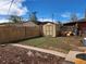 Landscaped backyard with shed and wooden fence at 985 Xavier St, Denver, CO 80204