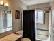 Clean bathroom with shower/tub combo and updated fixtures at 985 Xavier St, Denver, CO 80204