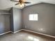 Spacious bedroom with gray walls, ceiling fan, and carpet at 985 Xavier St, Denver, CO 80204