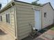 Tan colored siding and white door, a well-maintained exterior at 985 Xavier St, Denver, CO 80204