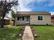 Ranch style home with well-maintained lawn and walkway at 985 Xavier St, Denver, CO 80204