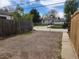 Gravel parking area with gate access to backyard at 985 Xavier St, Denver, CO 80204