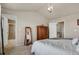 A bright bedroom features neutral walls, a large dresser, and a full-length mirror at 24317 E Powers Ave, Aurora, CO 80016