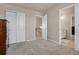 Neutral bedroom features plush carpet, a closet, and an ensuite bathroom at 24317 E Powers Ave, Aurora, CO 80016