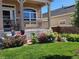 Inviting front porch with beautiful flowerbeds adds charm to this well-maintained home at 24317 E Powers Ave, Aurora, CO 80016