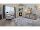 Comfortable living room with a fireplace, large windows, and a cozy seating area at 24317 E Powers Ave, Aurora, CO 80016