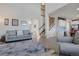 Bright, open-concept living room with hardwood floors and a view of the staircase at 24317 E Powers Ave, Aurora, CO 80016