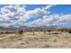 Expansive field with distant mountain views under a beautiful sky filled with clouds at 12338 W Dorado Pl # 305, Littleton, CO 80127
