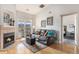 Inviting living room with a fireplace, comfortable seating, and a balcony overlooking a mountain view at 12338 W Dorado Pl # 305, Littleton, CO 80127