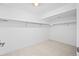 Empty closet with bars for hanging clothes and carpeted floor at 456 Cherry Street, Denver, CO 80220