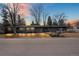 Home's front exterior with professional landscaping, dark brick, and large windows at 456 Cherry Street, Denver, CO 80220