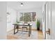 Bright office space with a large window, neutral decor, and hardwood floors at 456 Cherry Street, Denver, CO 80220