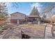 Expansive backyard with brick patio and garden area at 10826 Livingston Dr, Northglenn, CO 80234