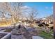Backyard view with pond and mature landscaping at 10826 Livingston Dr, Northglenn, CO 80234