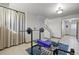 Finished basement with tile flooring and open workout area at 10826 Livingston Dr, Northglenn, CO 80234